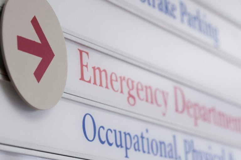 ER Productions Limited ©ERproductions Ltd/Blend Images LLC A sign points to an Emergency Department