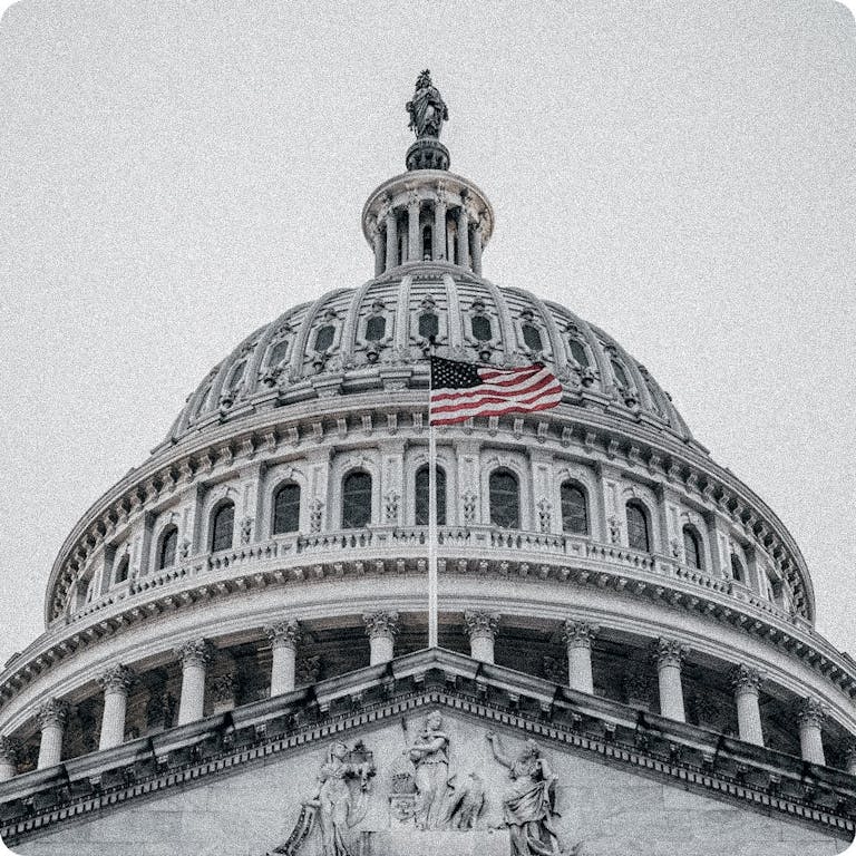 American flag in front of capital building