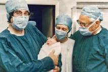 Photo: Keystone/Getty Images 25th July 1978:  The team who pioneered in-vitro fertilization, on the left Cambridge physiologist Dr Robert Edwards holding the world's first test tube baby Louise Joy Brown and (on the right) gynaecologist Mr Patrick Steptoe (1913 - 1988). She was born by Caesarian section at Oldham General Hospital, Lancashire.