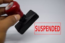 Photo: syahrir maulana/Getty Images Close up Red Handle Rubber Stamper and text suspended isolated on White Background.