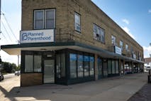 KENOSHA, WISCONSIN - SEPTEMBER 25: A sign hangs above the front door of a Planned Parenthood clinic on September 25, 2025 in Kenosha, Wisconsin. Planned Parenthood of Wisconsin will reportedly pause scheduling abortion appointments starting Oct. 1, due to fears of losing Medicaid funding because of a provision in the Trump administration's federal funding bill which bars clinics that provide abortions from accepting Medicaid funds for any of their other reproductive services.
