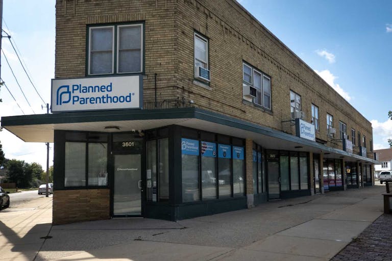 KENOSHA, WISCONSIN - SEPTEMBER 25: A sign hangs above the front door of a Planned Parenthood clinic on September 25, 2025 in Kenosha, Wisconsin. Planned Parenthood of Wisconsin will reportedly pause scheduling abortion appointments starting Oct. 1, due to fears of losing Medicaid funding because of a provision in the Trump administration's federal funding bill which bars clinics that provide abortions from accepting Medicaid funds for any of their other reproductive services.