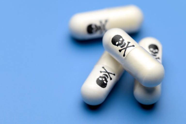 Poison pills with skull and crossbones.