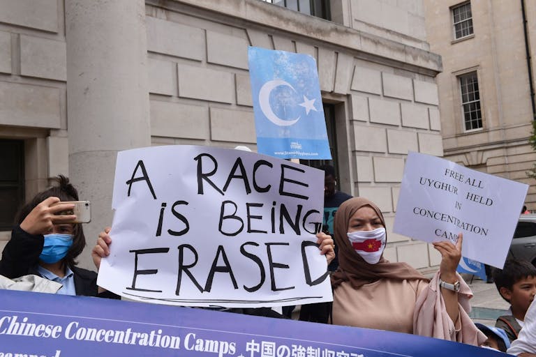 Photo: Thomas Krych/SOPA Images/LightRocket via Getty Images LONDON, UNITED KINGDOM - 2022/07/31: Protesters hold a banner and placards expressing their opinion during the demonstration. Uyghurs and UK Muslim organizations gathered opposite the Chinese embassy in London to protest against the Chinese government's involvement in ongoing human rights abuses against Uyghurs and other ethnic minorities.