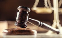 The judge's gavel and scales as a symbol of the judiciary and justice.