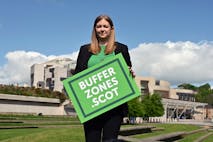 Photo: Ken Jack/Getty Images EDINBURGH, SCOTLAND - MAY 19: Scottish Green Party MSP Gillian Mackay holds a placard outside the Scottish Parliament in support of the creation of buffer zones around abortion clinics, where some clients have felt intimidated by protesters, on May 19, 2022 in Edinburgh, Scotland. Ms Mackay was launching a consultation on her legislative proposal to designate protest free 'buffer zones' outside abortion clinics across the country. (Photo by Ken Jack/Getty Images)