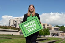 EDINBURGH, SCOTLAND - MAY 19: Scottish Green Party MSP Gillian Mackay holds a placard outside the Scottish Parliament in support of the creation of buffer zones around abortion clinics, where some clients have felt intimidated by protesters, on May 19, 2022 in Edinburgh, Scotland. Ms Mackay was launching a consultation on her legislative proposal to designate protest free 'buffer zones' outside abortion clinics across the country. (Photo by Ken Jack/Getty Images)