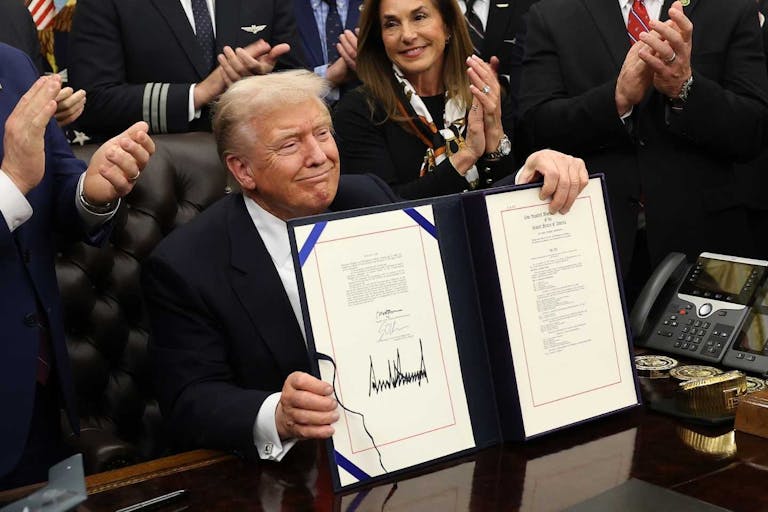 Photo: Win McNamee/Getty Images WASHINGTON, DC - NOVEMBER 12: U.S. President Donald Trump signs funding legislation to reopen the federal government as he is joined by Rep. Lisa McClain (R-MI), other Republican lawmakers and business leaders, during a ceremony in the Oval Office of the White House on November 12, 2025, in Washington, DC. The legislation, passed by the House of Representatives tonight, funds the federal government until the end of January 2026 and ends the 43-day government shutdown, the longest in the nation’s history.