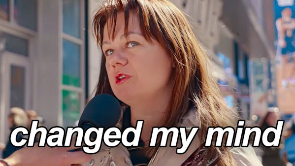 woman on city sidewalk, caption: "changed my mind"