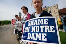 SOUTH BEND, IN - MAY 17: Anti-abortion activists from Virginia demonstrate near the campus of Notre Dame University on May 17, 2009 in South Bend, Indiana. Activists from around the country have gathered in South Bend to protest the university's decision to invite President Barack Obama, who supports abortion rights, to deliver the commencement address today and to award him an honorary degree.