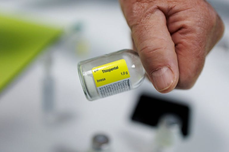 Photo: Simon Wohlfahrt/AFP via Getty Images A doctor holds a flask of "Thiopental" a barbiturate that is used in the practice of euthanasia, in a hospital in Belgium, on February 1, 2024. In 2022, 2,966 people underwent euthanasia in Belgium, according to the federal oversight commission. Of that total, 53 were resident in France