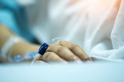 hand with an IV attached.