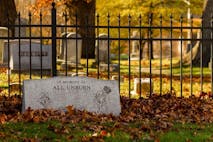 Photo: Grandbrothers/Getty Images Rockville, MD, USA, 11/16/2020: A tombstone in the grave yard by historic Saint Mary's Church with fallen leaves covering it. It is erected for the memory of all unborn children lost before birth.