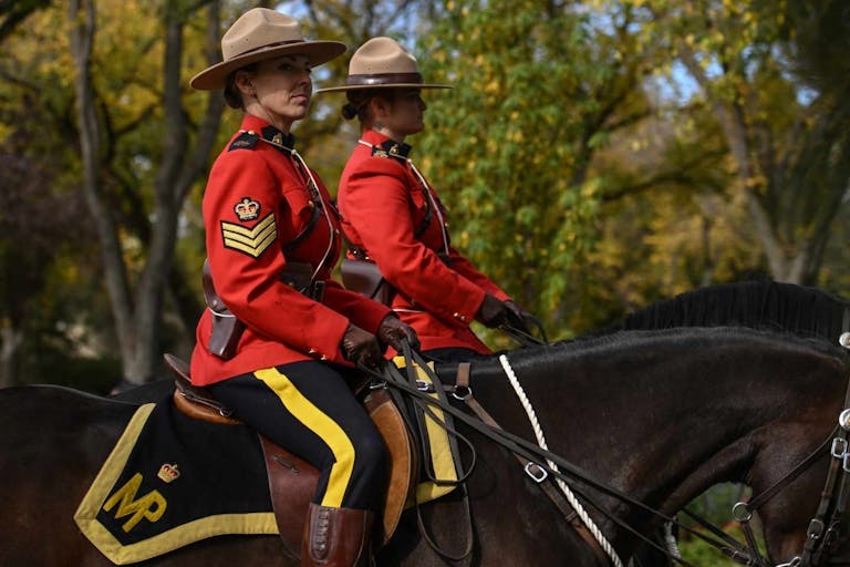 Photo: Artur Widak/NurPhoto via Getty Images EDMONTON, CANADA - SEPTEMBER 24, 2023: Members of the Royal Canadian Mounted Police take part in the 25th annual Alberta's Police and Peace Officers' Memorial Day ceremony on the Alberta Legislature Grounds, on September 24, 2023, in Edmonton, Alberta, Canada. Today, three new names were added to the Pillar of Strength memorial, a monument honoring Alberta's police and peace officers. Since 1876, 104 police and peace officers have lost their lives in the line of duty in Alberta Province, and this solemn occasion serves as a reminder of their sacrifice.