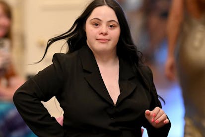 LONDON, ENGLAND - JUNE 13: Ellie Goldstein on the runway during Fashioning Change: Why Inclusion is the Future of Fashion at Carlton House Terrace on June 13, 2025 in London, England.