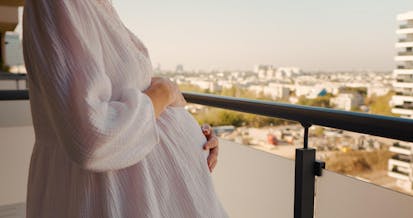 Romanian gendarmes guard the headquarters of the Sabyc private clinic, which features a poster reading: "With Us It's Possible..." in Bucharest on July 20, 2009. Three persons, comprising two Israeli doctors and a Romanian employee, all specialized in in-vitro fertilization (IVF) were placed under inquiry in relation with an alleged traffic of human eggs, involving the clinic founded in Bucharest in 1999 by Israeli doctors. According to the preliminary results of the inquiry, the clinic was paying egg donors 800 to 1,000 leis (190 to 238 euros) when Romanian law prohibits such payments. Most of the egg recipients and IVFs were Israeli, Italian and British women.