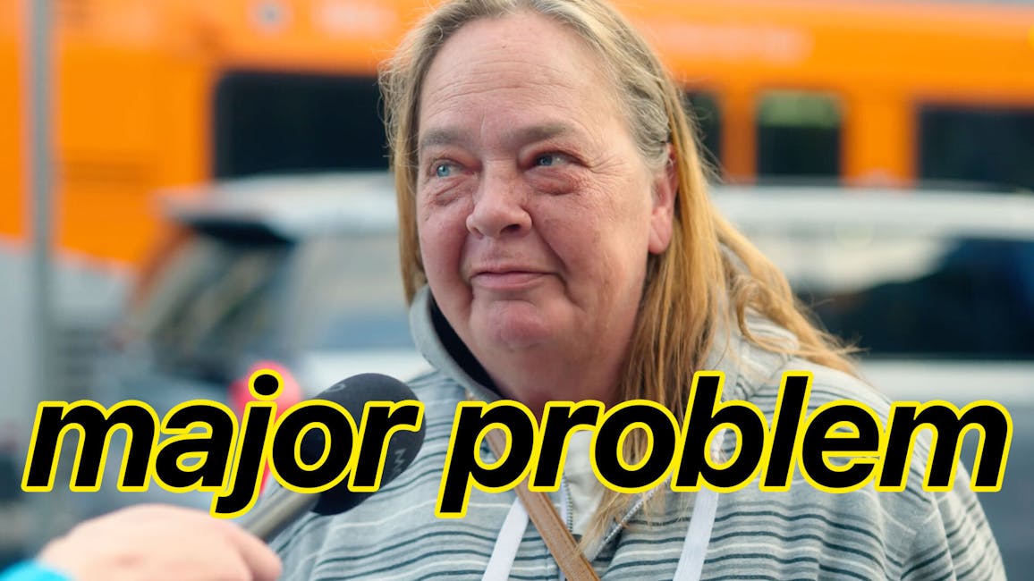 white woman being interviewed on the street, caption: major problem