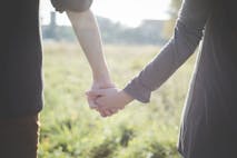 Photo: Eugenio Marongiu/Getty Images Young couple holding hands in sunlight