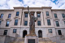 Missouri Green County Courthouse Building with the Statue of Liberty at the Entrance in the City of Springfield: A small town American Heartland historic tourist attraction - stock photo
