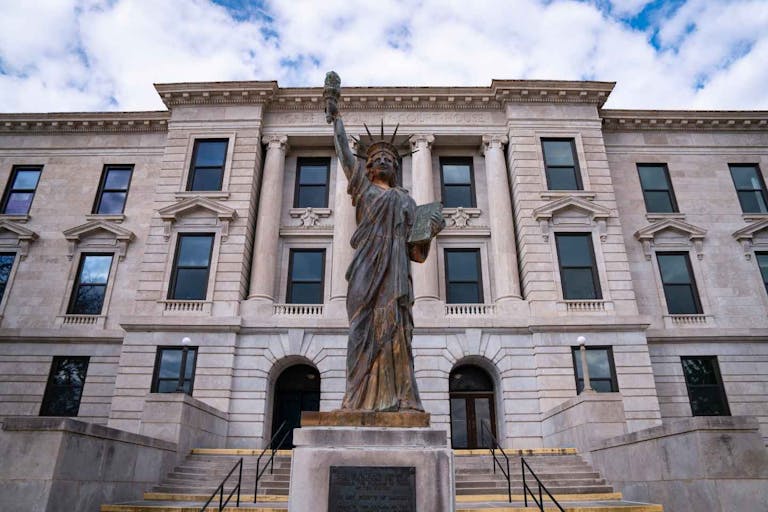 Missouri Green County Courthouse Building with the Statue of Liberty at the Entrance in the City of Springfield: A small town American Heartland historic tourist attraction - stock photo