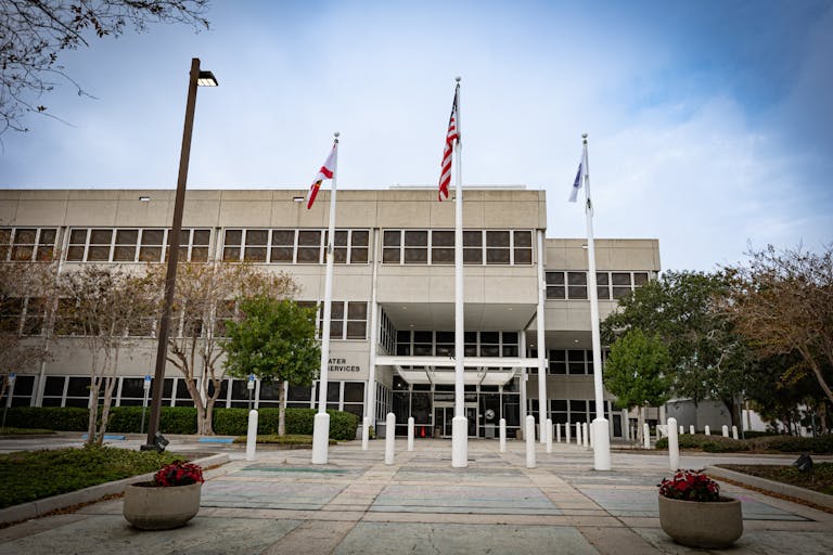 Photo: Ivelin Denev/Getty Images Clearwater, Florida USA - December 28 2023: Clearwater government municipality services building with flags in front of it