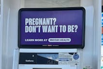 Photo: Mayday Health/Facebook An ad at a gas station promoting abortion.