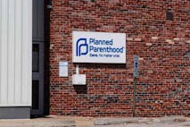 Planned Parenthood sign on brick building. Planned Parenthood location. Planned Parenthood provides reproductive health services in the US VI - stock photo Champaign - Circa August 2019: Planned Parenthood location. Planned Parenthood provides reproductive health services in the US VI
