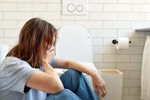 Photo: Ekaterina Demidova/Getty Images pregnant woman sick toilet