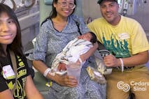 Screenshot: Lopez family photo (Cedars-Sinai) Suze Lopez and family holding baby Ryu