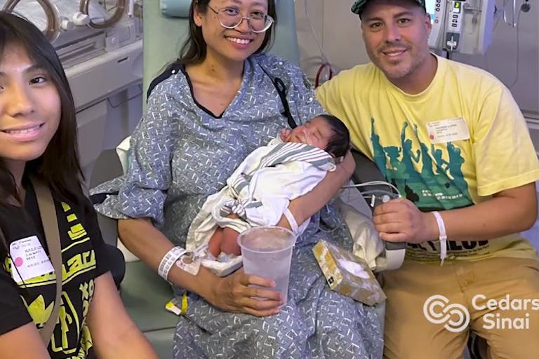 Suze Lopez and family holding baby Ryu