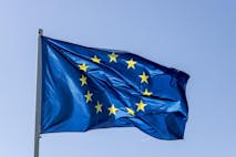 Photo: fhm/Getty Images European Union - EU-flag in the blue sky - stock photo