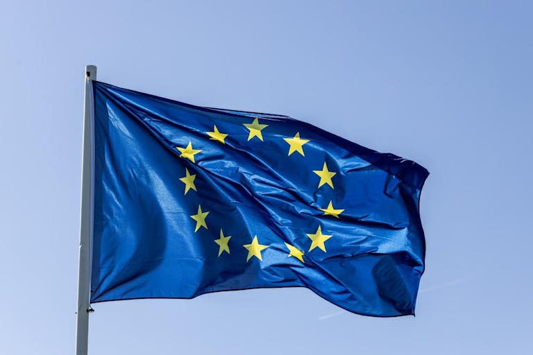European Union - EU-flag in the blue sky - stock photo