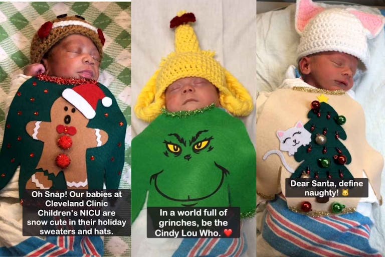 The photo shows three babies in the NICU at Photo: Cleveland Clinic Children's Facebook. The first is wearing a gingerbread man sweater. The second is wearing a Grinch sweater and hat like Cindy Lou Who's blond hair. The third is wearing a Christmas tree sweater featuring a cat climbing the branches.