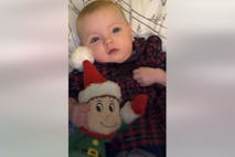 Photo: Belfast Live Image shows baby girl holding a stuffed elf for Christmas.