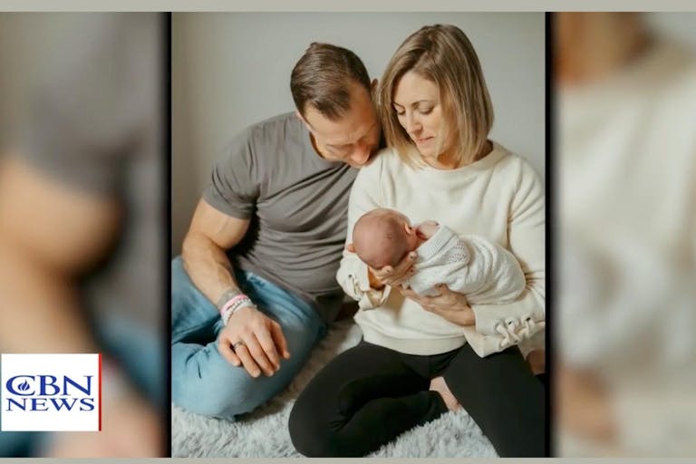 Photo is a screenshot of a CBN video featuring Karen and Anthony Monetti and their baby.
