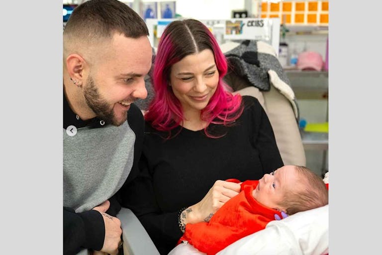 Photo: Cleveland Clinic Children's Instagram Dylan Carter and Drew Kline hold and smile at baby Sixx.