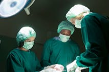 urgeons are performing heart transplant operation for a serious patient. - stock photo Surgeons are performing heart transplant operation for a patient.