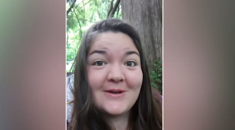 Photo shows a smiling Eileen Mihich in the woods.