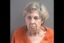 Photo: Volusia County Sheriff's Office Image shows an elderly woman in a mugshot with short grey-blonde hair and an orange prison jumpsuit.