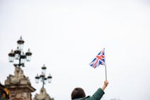 Photo: ozgurcankaya/Getty Images child waving flag of Great Britain