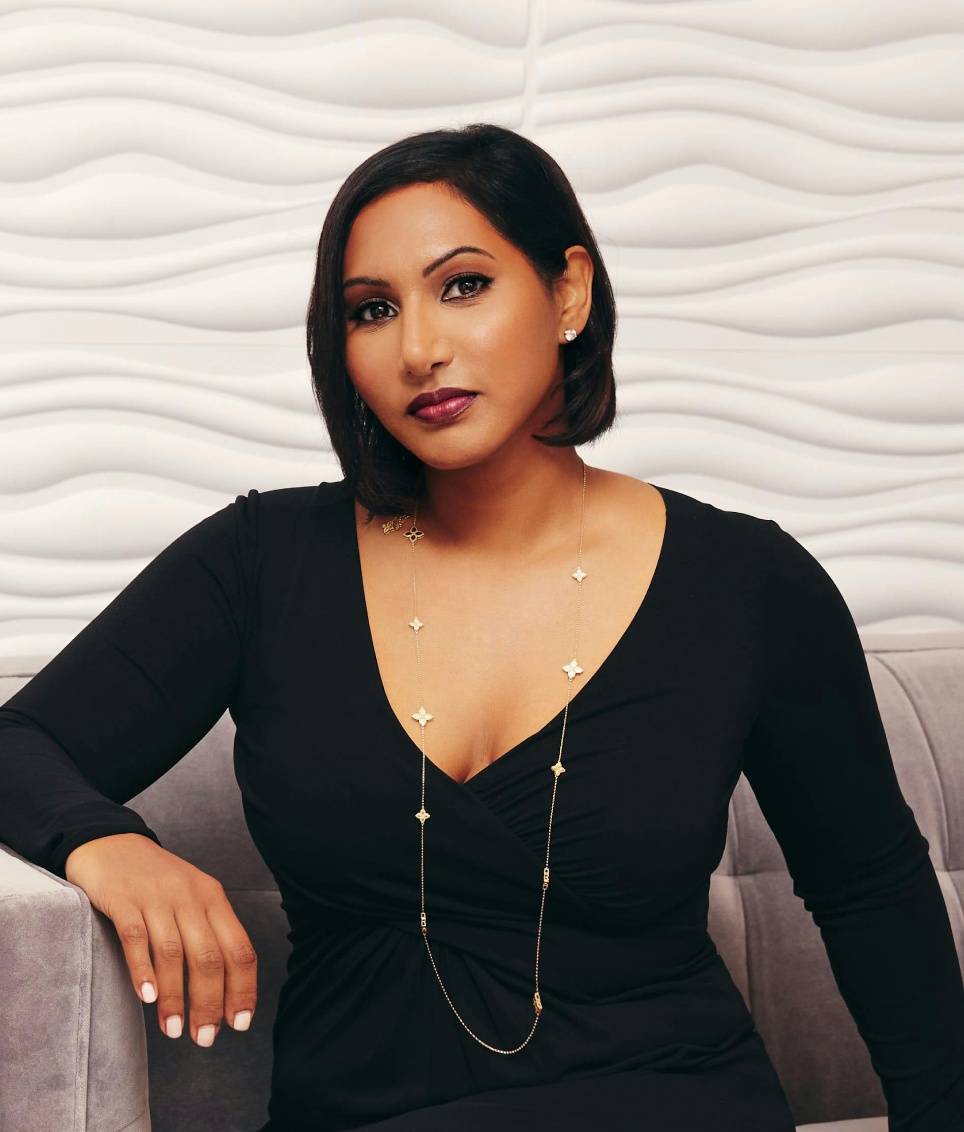 Dr. Anu Antony sitting down