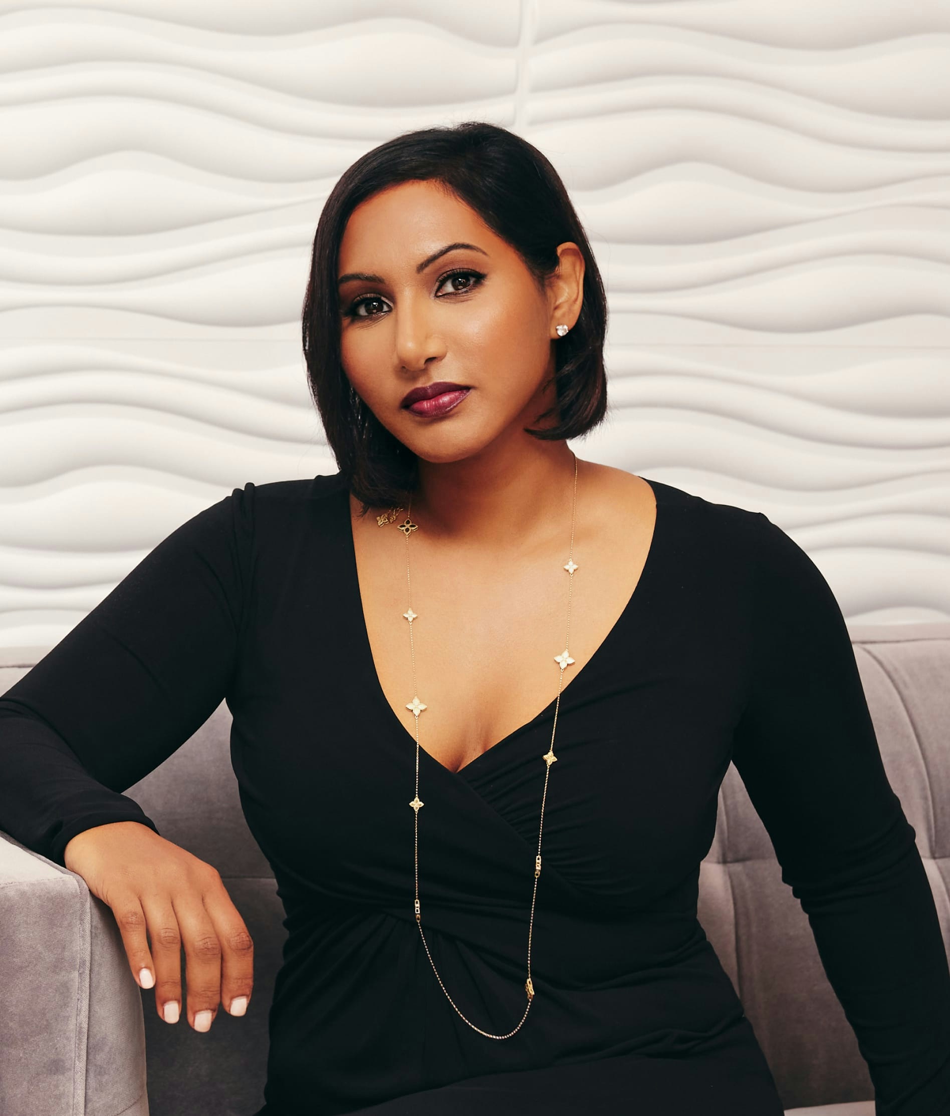 Dr. Anu Antony sitting down