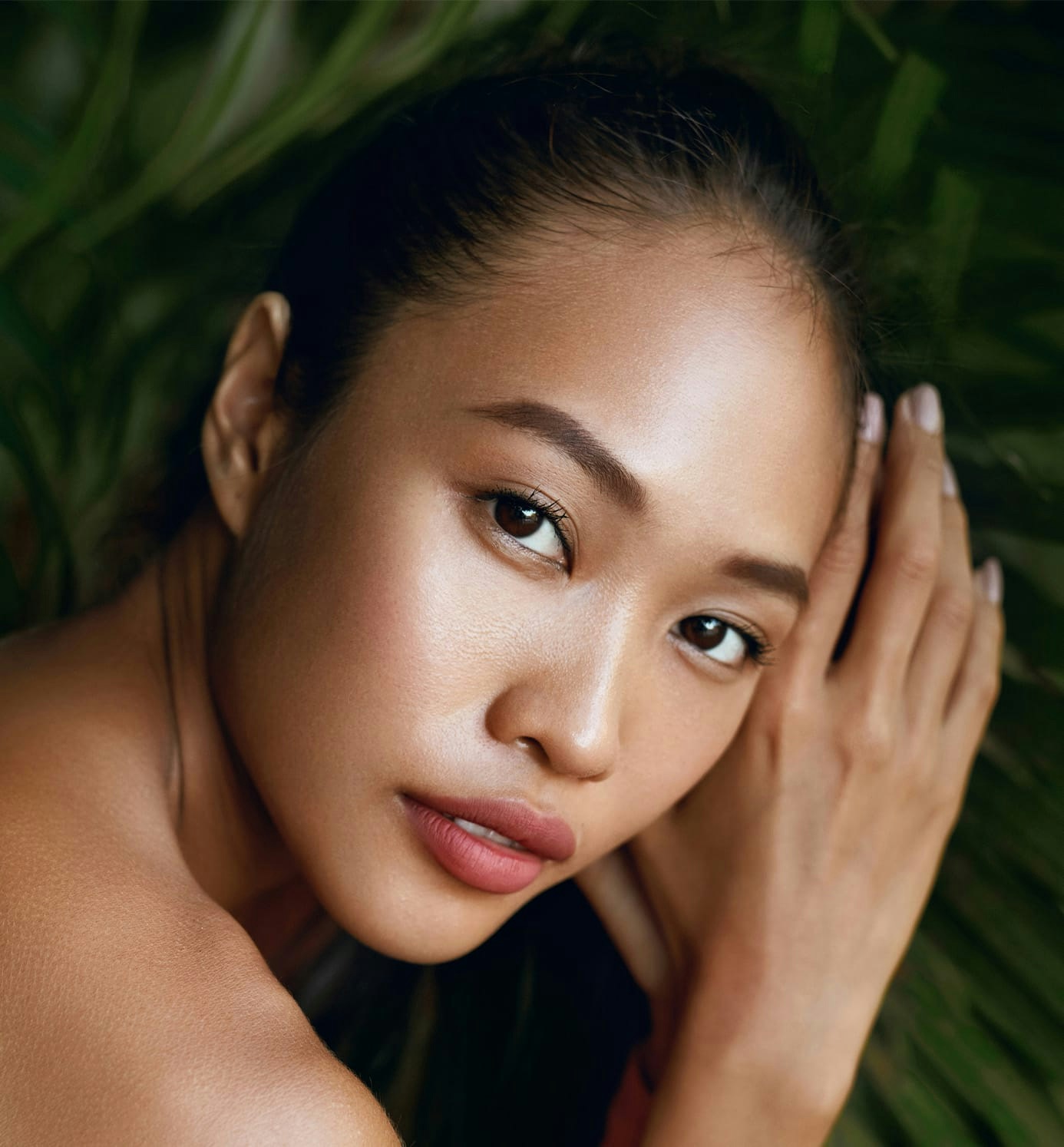 woman looking forward with hands together