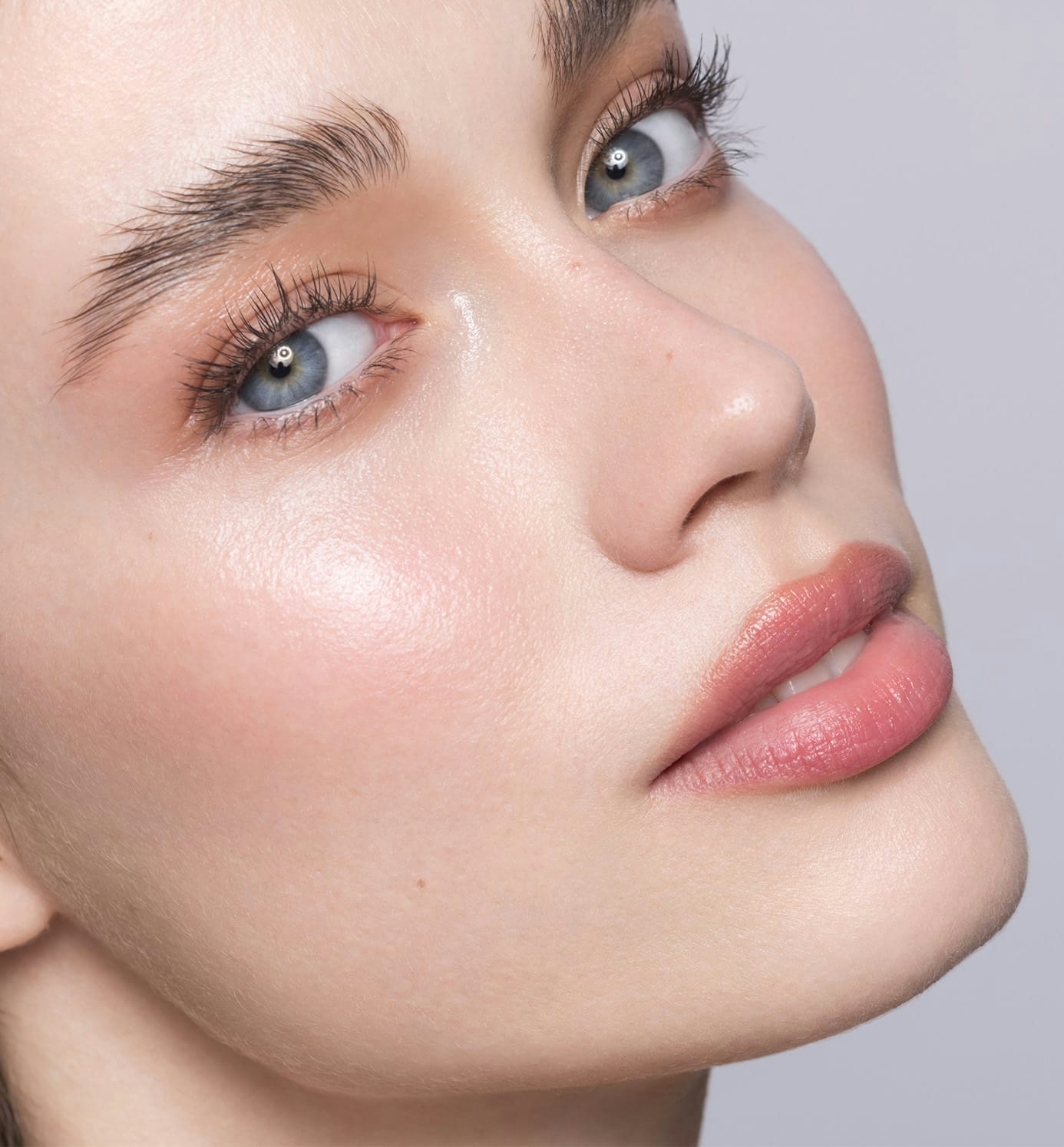 woman with blue eyes raising her chin looking forward