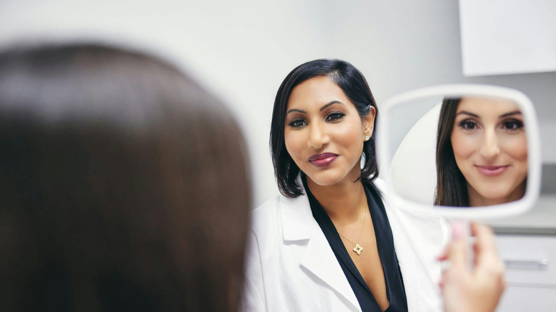 Dr. Anu Antony working with a patient
