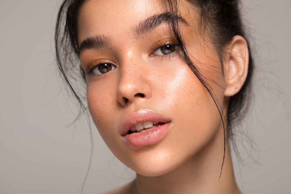 doctor holding syringe about to inject into patient's forehead