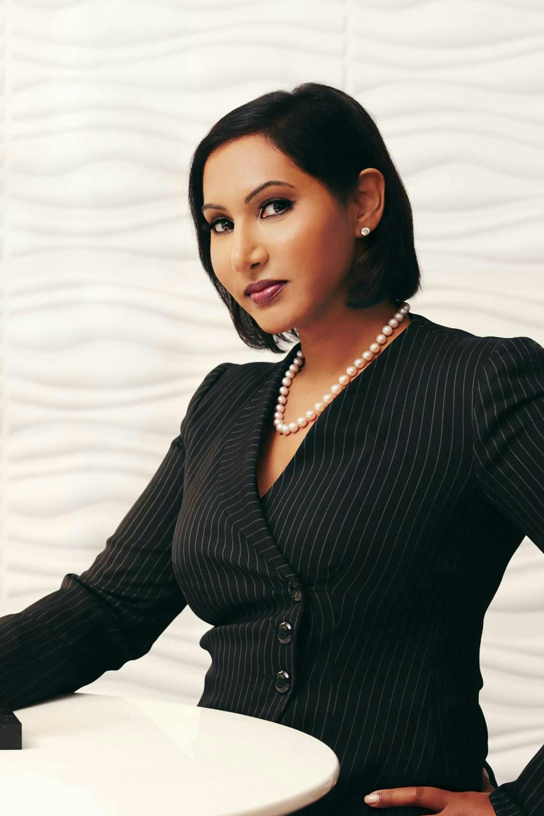Dr. Antony standing in a suit