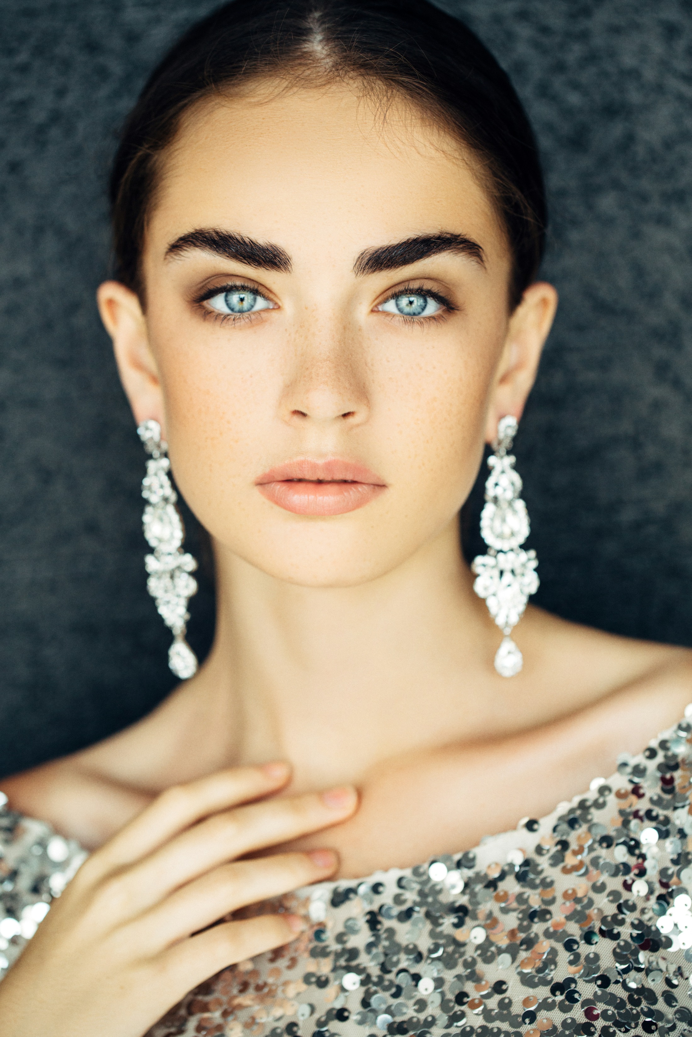 Woman looking into camera with smooth skin