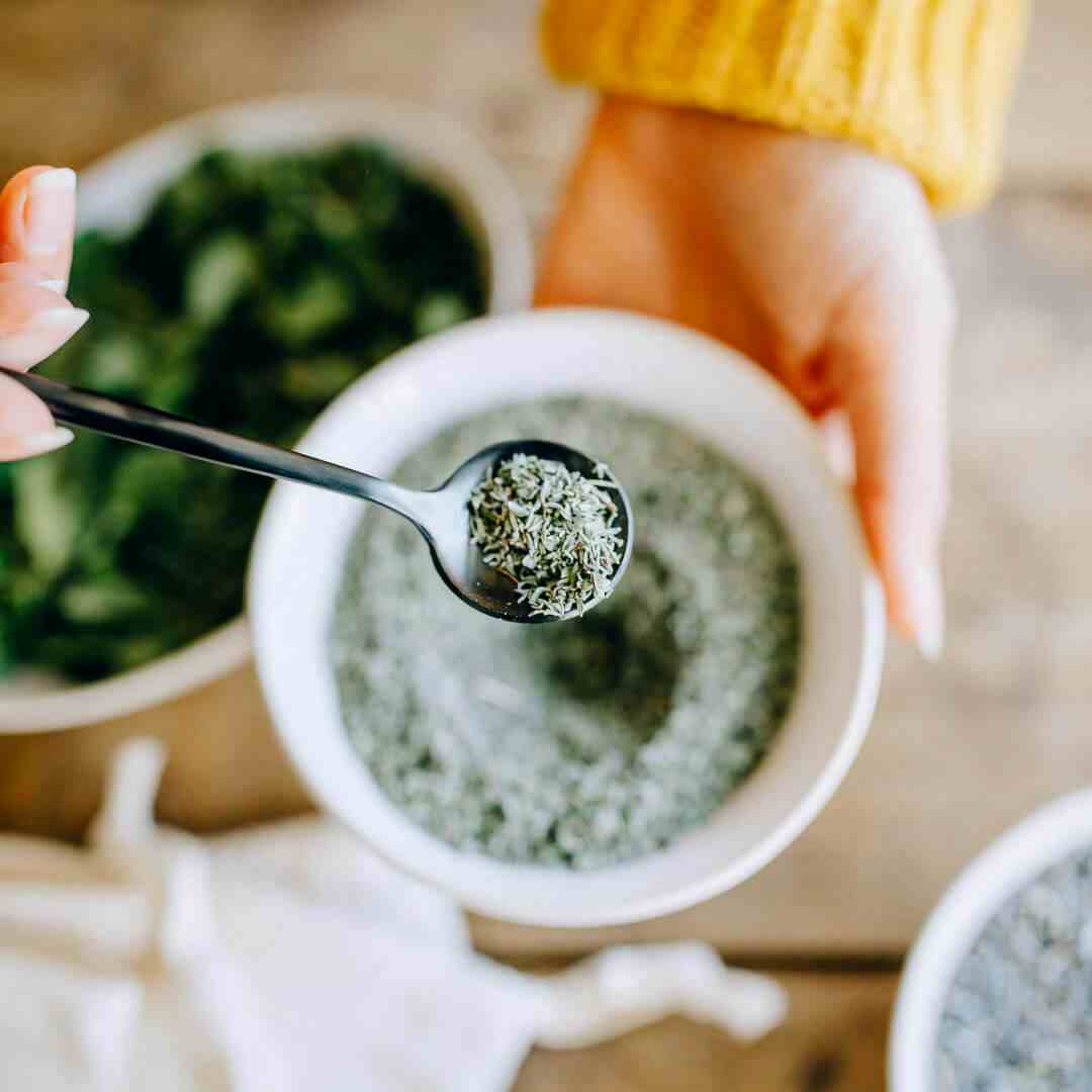 dried herbs on spoon