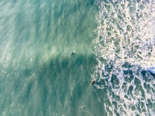 Aerial shot of surfers at Mangamaunu break